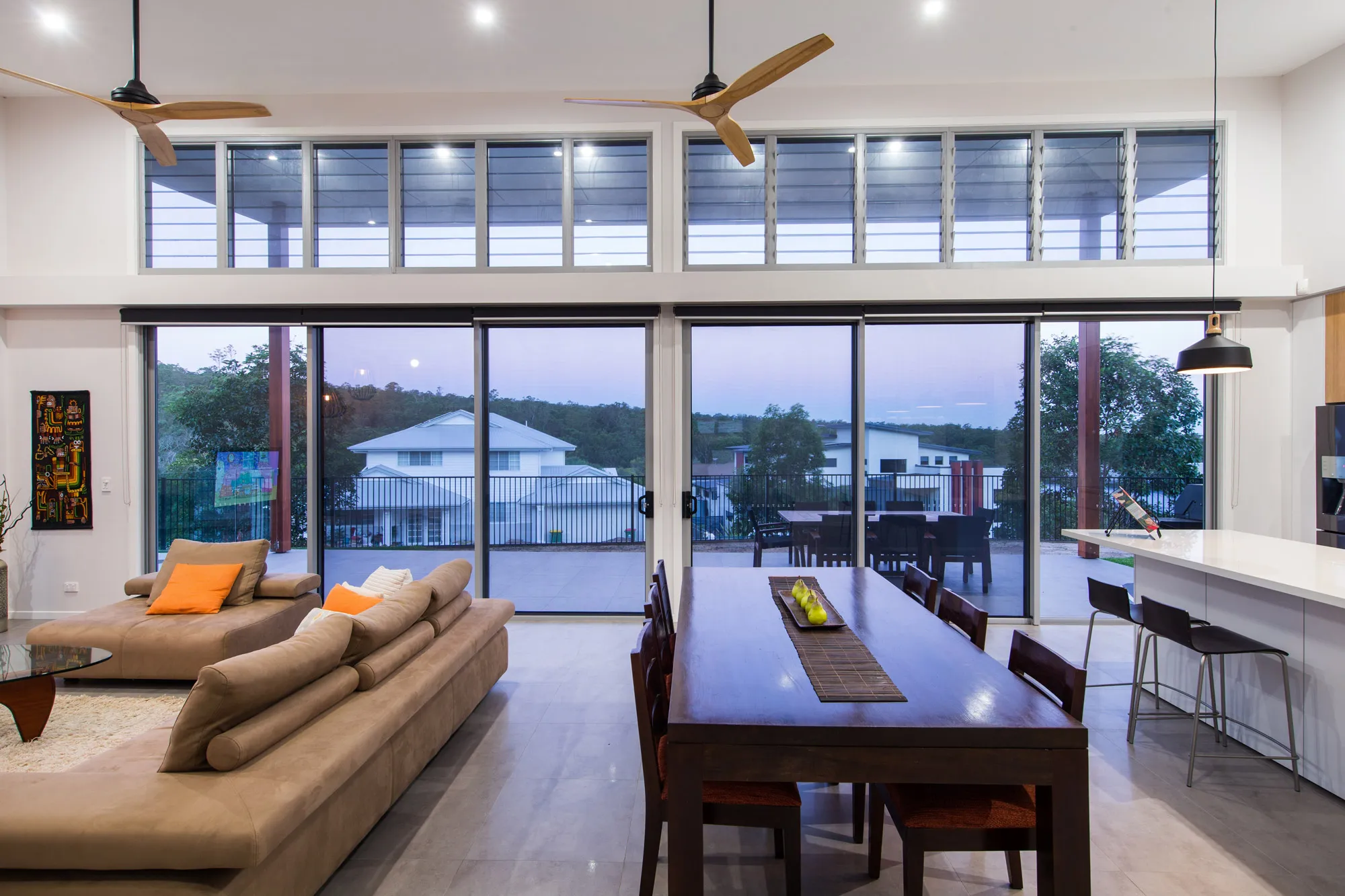 Inside house view of sliding ForceField Security screen doors to outside entertainment area